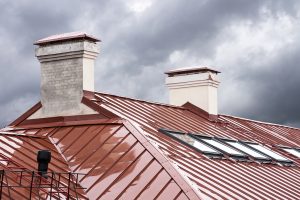 new red metal roof with skylights in rain